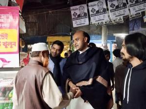 Arafat Ashwad Islam talking to a person during a social event in Gulshan, Dhaka.