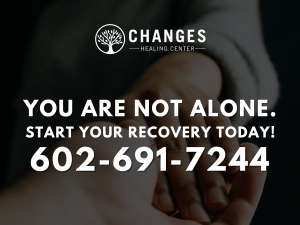 Outstretched hands intertwine to show the concept of Make the confidential call to Changes Healing Center today for proven programs to support sobriety!