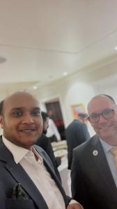 Arafat Ashwad Islam with the American Ambassador Peter Haas at a reception.