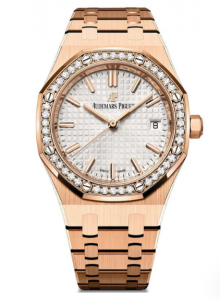 A rose gold watch with a cream watch face that is surrounded by diamonds.