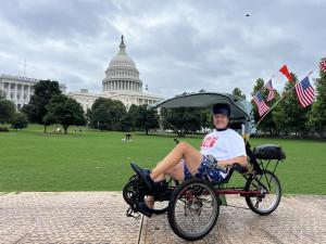 Aaron Novinger completes 2,000 mile bike ride,  on the Capital steps in Washington, DC., raising awareness and funds for Ponzi scheme victims during the Pedaling For Ponzis Charity Bike Ride.