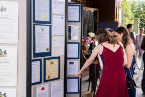 UK writer winners, Rose and Alice Robilliard, reviewing some of the 122 proclamations and awards recognizing L. Ron Hubbard and the Writers and Illustrators of the Future.