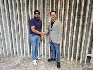 Actxa CEO, Marcus Soo (right) and Dr Abhinav (left) shaking hands