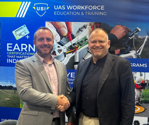 USI President & CEO, Josh Olds Shakes Hands with ESTA President & CEO, Ole Petter Bakken at the 2024 Energy, Drone + Robotics Summit in Houston, TX.