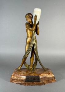 Circa 1930 Art Deco gilt bronze sculpture by Pierre Laurel (French, 1892-1962), featuring an alabaster water jug and an onyx base, 18 ½ inches tall, with inscribed signature (est. $8,000-$12,000).