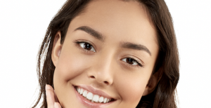 Woman smiling with clear skin.