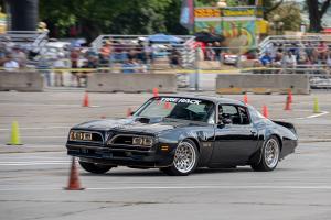 A black Trans Am racing on the autocross track