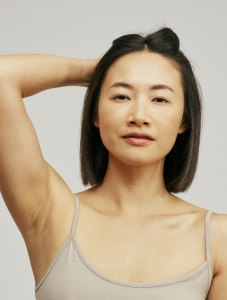 Front shot of Asian female with shoulder long black hair, middle parting