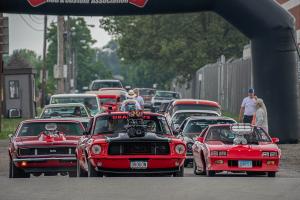 Rows of classic cars cruising into the fairgrounds.