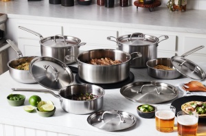 A collection of stainless steel cookware on a counter.