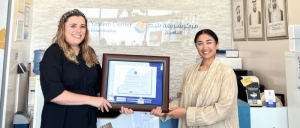 Bianca Raubenheimer of IBCCES awarding the Certified Autism Center™ renewal certificate to Sharifa Yateem, founder and clinical director of Sharifa Yateem Center for Rehabilitation.