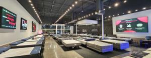 Inside of Mattress Warehouse store showing extensive selection of quality products