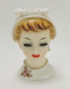 Relco lady head vase with one earring missing, 7 ½ inches tall. Estimate: $400-$600; minimum bid $1.
