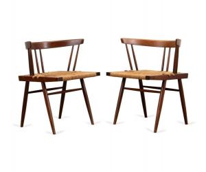 Circa 1960s black walnut ‘Grass-Seated Chairs’ by George Nakashima (American, 1905-1990), having a round back over spindle supports, resting on a woven grass seat and raised on turned legs ($7,260).