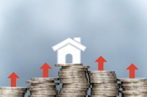Render of houses on top of coin stacks