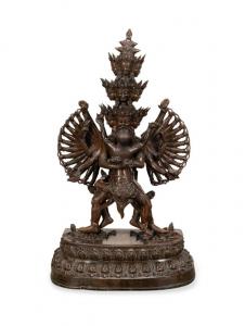 Large 18th century (or earlier) Tibetan copper alloy figure of Chakrasamvara and Vishvamata, with multiple heads and arms, crushing numerous figures, 35 ¼ inches tall (est. $5,000-$10,000).