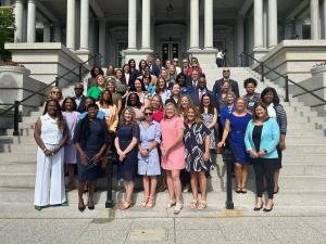 Stillbirth prevention advocates from Healthy Birth Day, Inc. and other organizations are pictured outside the White House complex in July 2024.