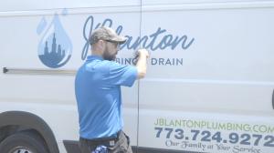  J. Blanton Plumbing technician working on a company truck, highlighting plumbing services, repairs, and maintenance offered by the company.