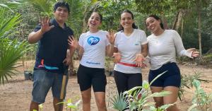 People doing reforestation at Kabah Park in Cancun.