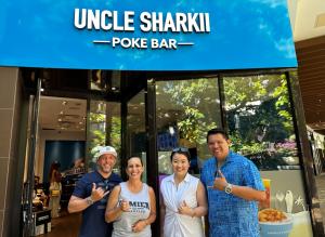 Uncle Sharkii Poke Bar transfer to International Market Place, shows Sonny Carvalho and Carla Dutro with Fen Reyes and Raymond Reyes