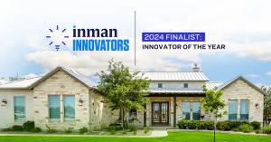 a modern stone home with Inman awards logos in the sky