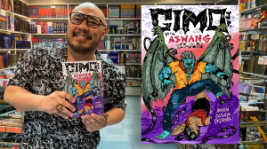 Filipino Middle Grade Author Andrew Jalbuena Pasaporte shows copy of his book Gimo Jr. and the Aswang Clan.
