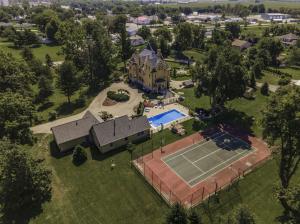 Forty-two acres of grounds including an in-ground pool, gazebo, arboretum and tennis court