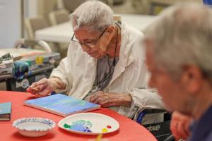 Residents of Lakeview Commons enjoy a painting class.