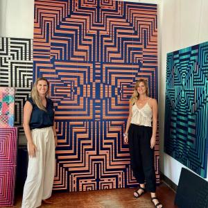 Artist Katrin Aason and MÍRAME co-founder Belinda Seppings in Aason's studio, standing in front of Katrin Aason's woven ribbon paintings