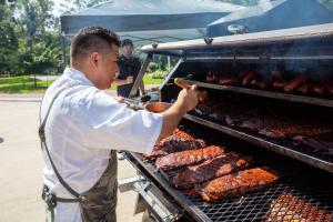 Houstonian Executive chef Gonzalo Campos prepares over 1000 plates of authentic Texas BBQ for the hotel's fundraiser on June 20.