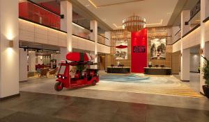 Modern and Elegant lobby of Radisson RED Phuket Patong Beach that shows a red tuk tuk