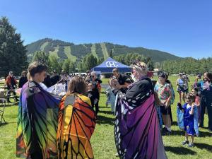 Dressed as butterflies, participants make fun during The Grand Butterfly Gathering on June 29, 2024, at Davey Jackson Field, Jackson, Wyoming. Photo: Trueness Project
