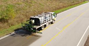 Overhead photo of Replay being sprayed on a highway. RePlay is an environmentally friendly and cost-effective alternative to repaving and is made from North American-grown soybeans.