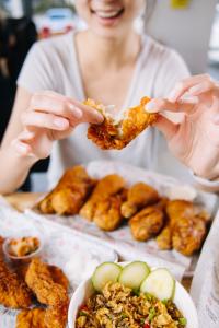 Bonchon chicken wings come with a complementary side of coleslaw or pickled radish.