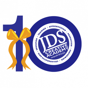 JDS Creative Academy 10 year logo with a yellow ribbon