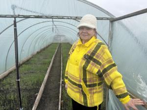 Woman farmer in her greenhouse