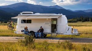 A Couple Camping in Colorado with their Oliver Travel Trailer