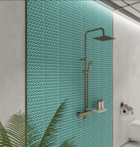 A shower with floor to ceiling turquoise wave tiles crafted by LiLi Tiles.