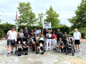 Large group of adults and children with Team NJ sign getting ready for Sophia's Stroll.