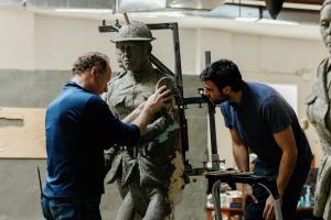 Sculptors Sabin Howard and Charlie Mostow working on Doughboy figure