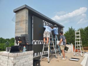 YOLO TV Partner OLW was trained to install this 202 inch outdoor wall mount TV. This giant outdoor tv is the centerpiece of their client's backyard.