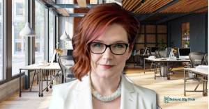 women red hair glasses headshot on office background