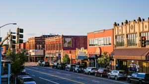 Brick buildings line a bustling Main Street in Kalispell, Montana.