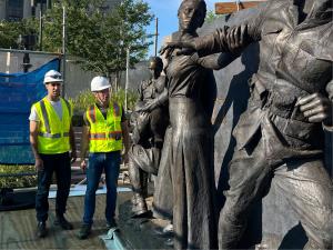 Sculptors Howard and Mostow check installation of A Soldiers Journey