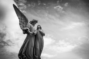 Angel Statue Under Cloudy Skies