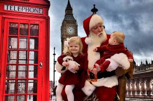 A family poses with Santa Claus "London" in this example of a Santa Around the World Photo Green Screen Photo Booth.