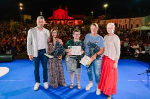 Award winners National Meeting of Madonnari in Grazie di Curtatone, Italy with three of the nine Award Winners, Emanuela Cerutti from Italy, Sonja Mazereel Belgium and Julie Kirk Purcell from the United States standing on the stage during the award ceremo