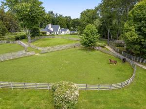 Equestrian facilities: 12-horse stable, laser-leveled ring, paddocks, and more