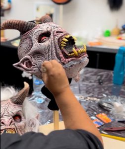 Artist Painting Handcrafted Halloween Masks at thehorrordome.com