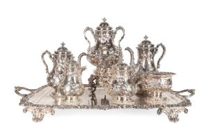 Seven-piece coin silver floral repousse hot beverage service by Grosjean & Woodward (American, 1847-1862), all hallmarked and the total weight, excluding tray, is 190.08 ozt. (est. $6,000-$8,000).